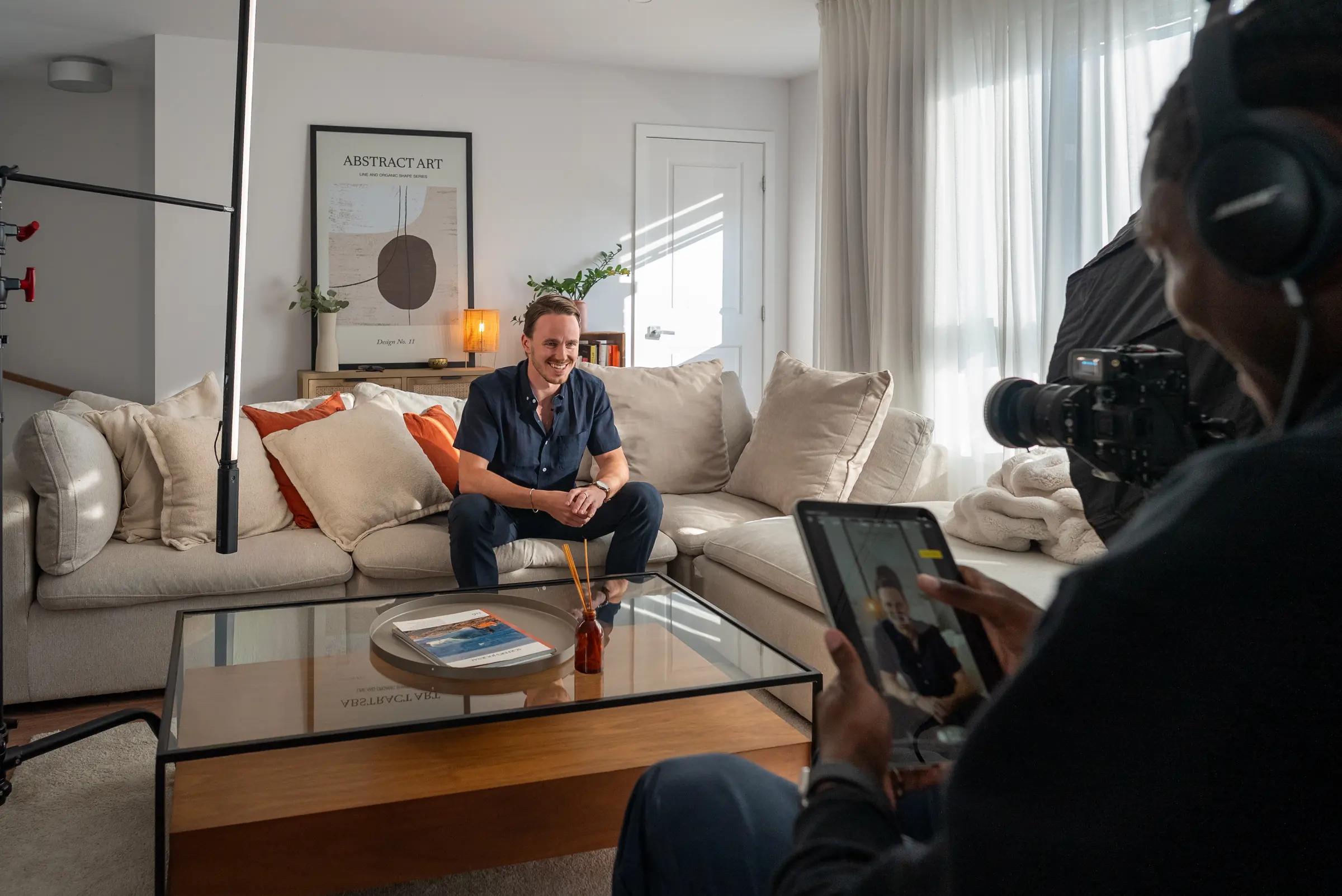 Ben Latour laughing on set between takes while Isaiah Norfleet checks the shot on a monitor